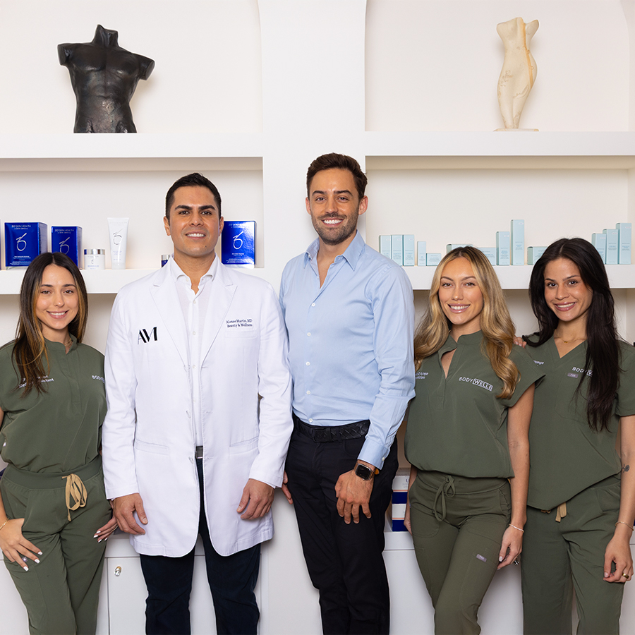 AM Beauty & Wellness team posing in clinic, highlighting their expertise in personalized diagnostic wellness testing.
