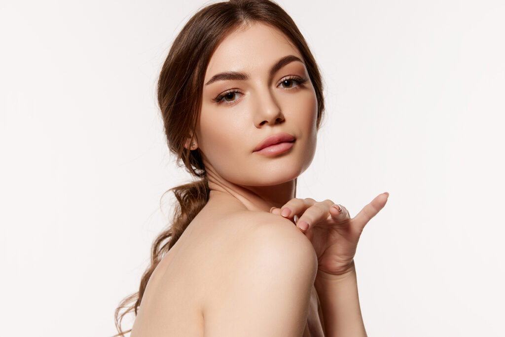 Close-up of a woman preparing for a lip filler appointment with hydrated, healthy lips.
