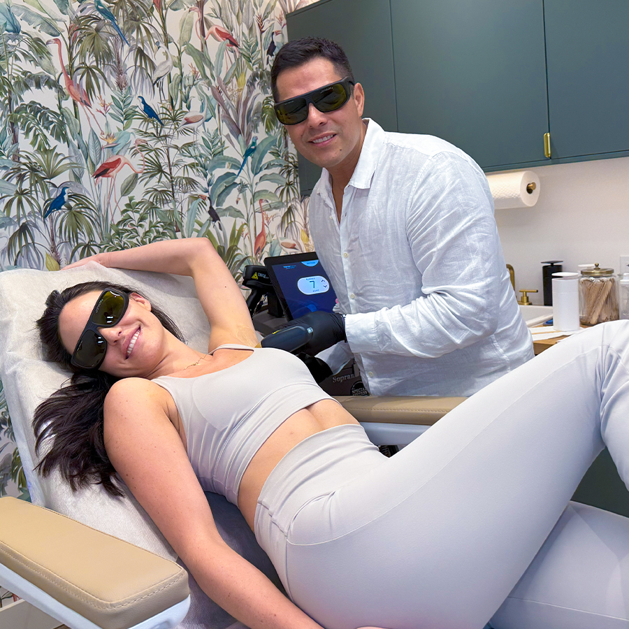 Patient receiving underarm laser hair removal at BODYWELLE clinic with specialist using advanced laser equipment