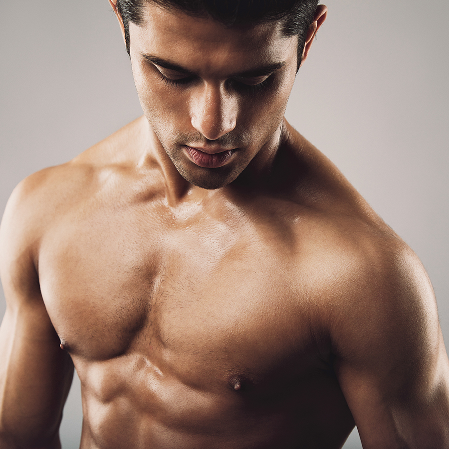 Fit male torso highlighting muscle tone and definition, illustrating peptide effects on muscle repair and growth