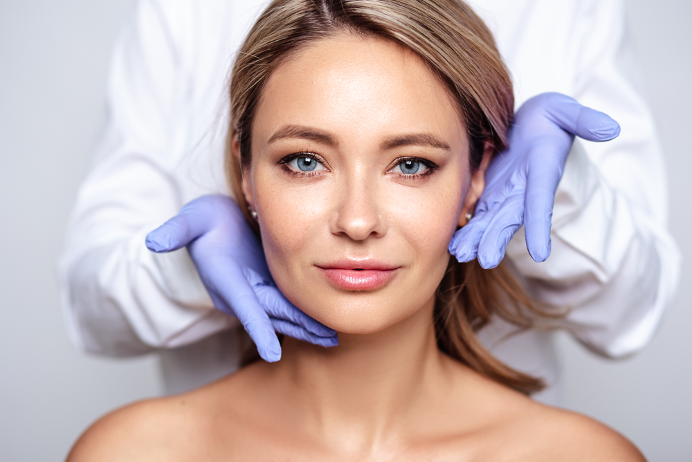 Woman receiving professional skincare evaluation before treatment, highlighting collagen-boosting results and minimal downtime.