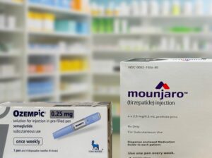 Mounjaro and Ozempic injection boxes on pharmacy counter used for diabetes and weight loss treatment in Miami.