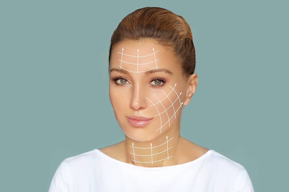 Front view portrait of a woman, featuring white structural grid lines and vector arrows mapped across her forehead, cheek, and neck.