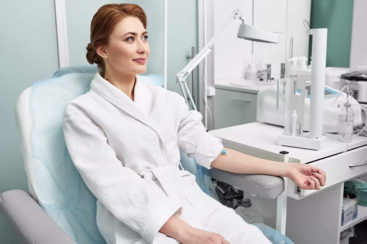 Patient receiving an IV-based wellness treatment in a medical clinic.
