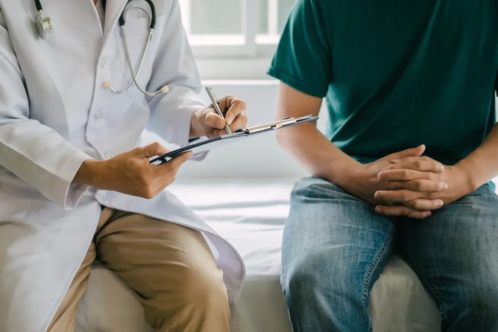 Male patient discussing men’s health with a medical provider.